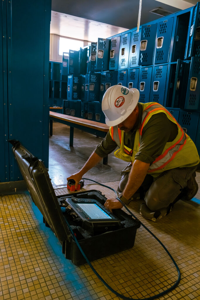 Man at work scanning concrete