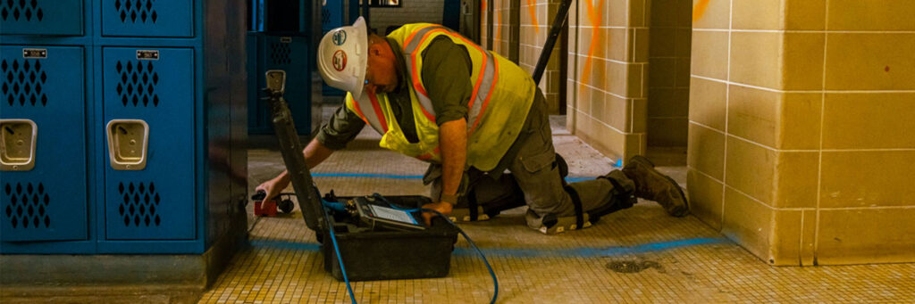 Man at work scanning concrete